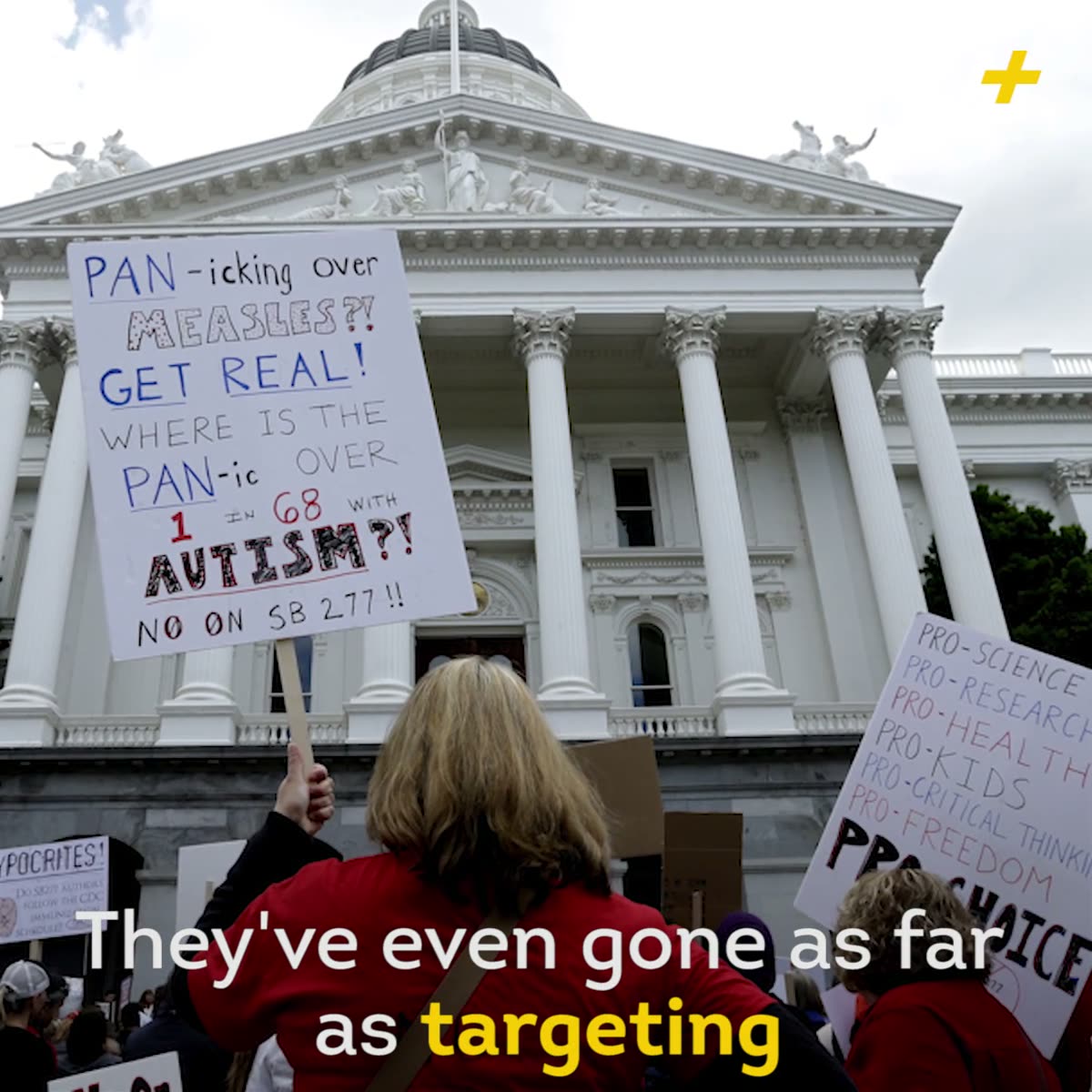 Anti-vaccine protest signs outside the California state capitol